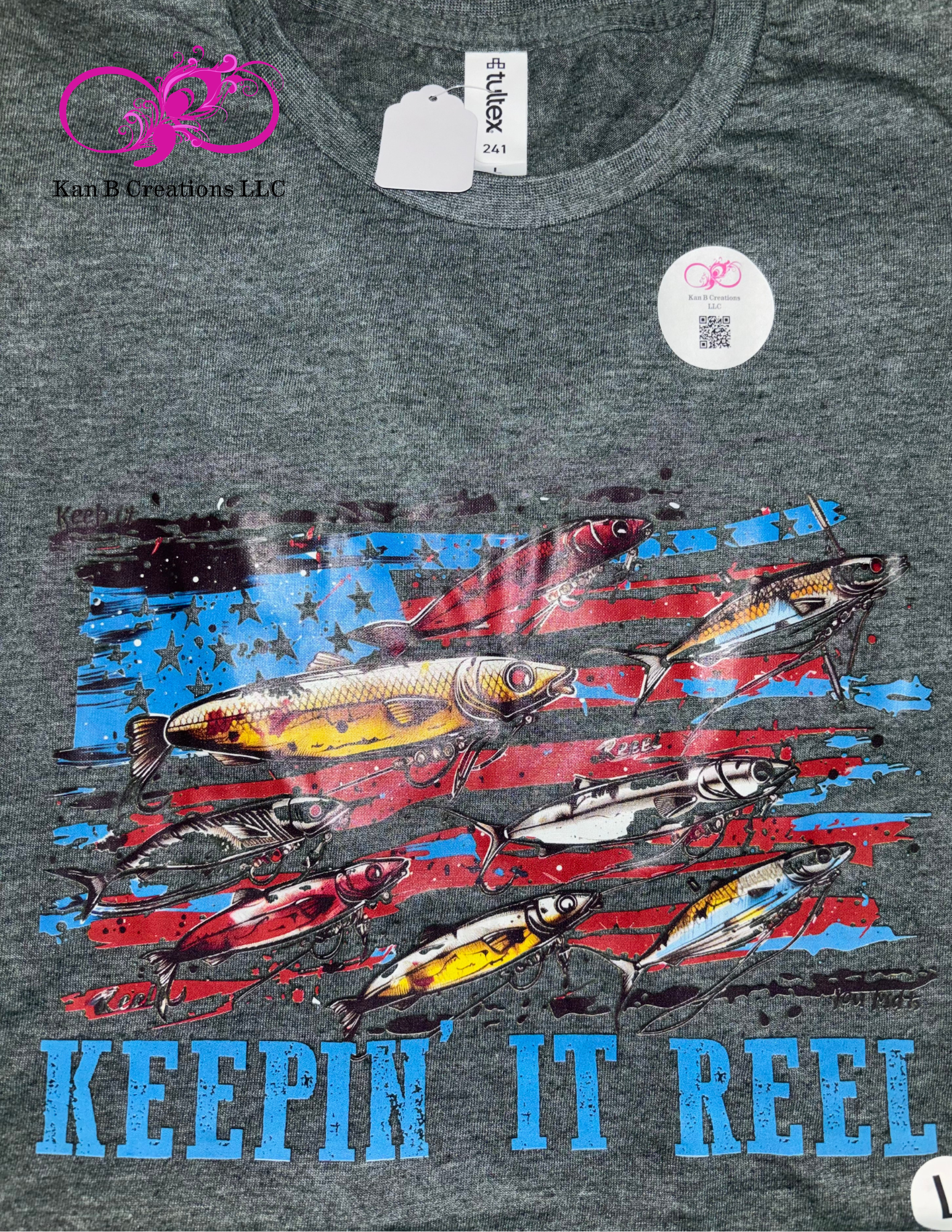 Fish lures graphic and 'Keepin' It Reel' text on a dark heather forest tshirt.
